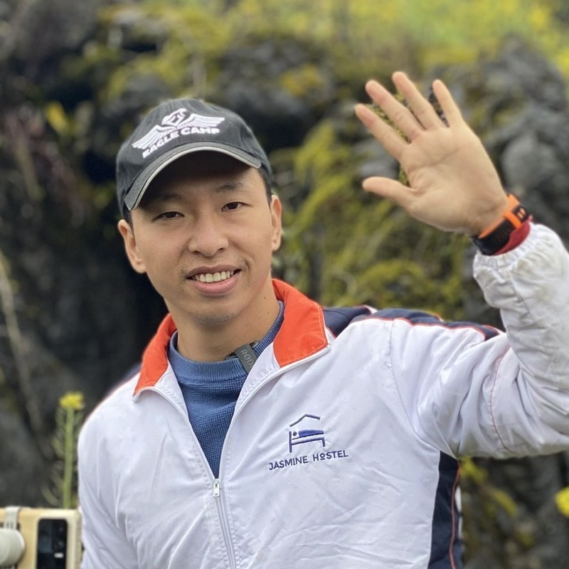 Nguyen Van Tuan, Director of Jasmine Tours, in a Jasmine Hostel jacket